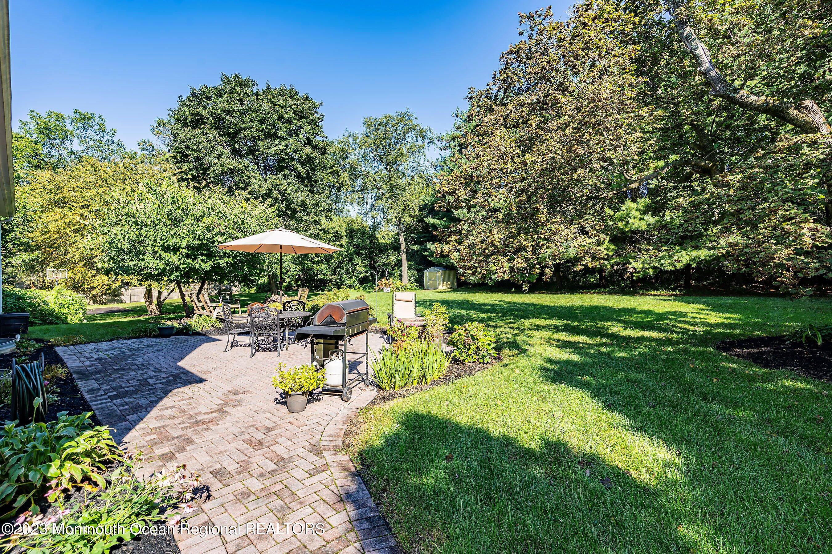 154 Adelphia Road Farmingdale, NJ 07727 - Photo 29 of 34 a view of a backyard with sitting area