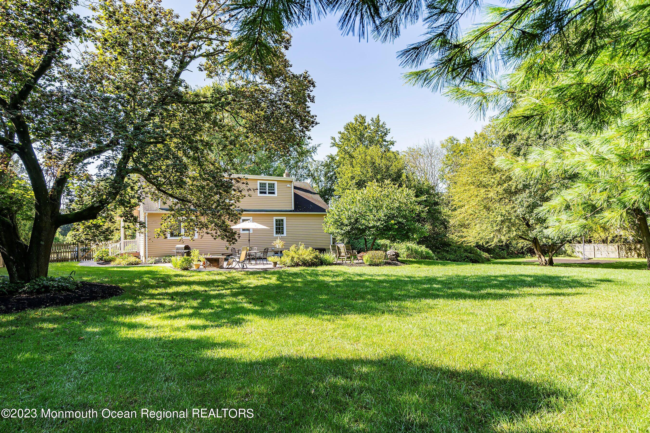 154 Adelphia Road Farmingdale, NJ 07727 - Photo 34 of 34 a front view of a house with a yard and trees