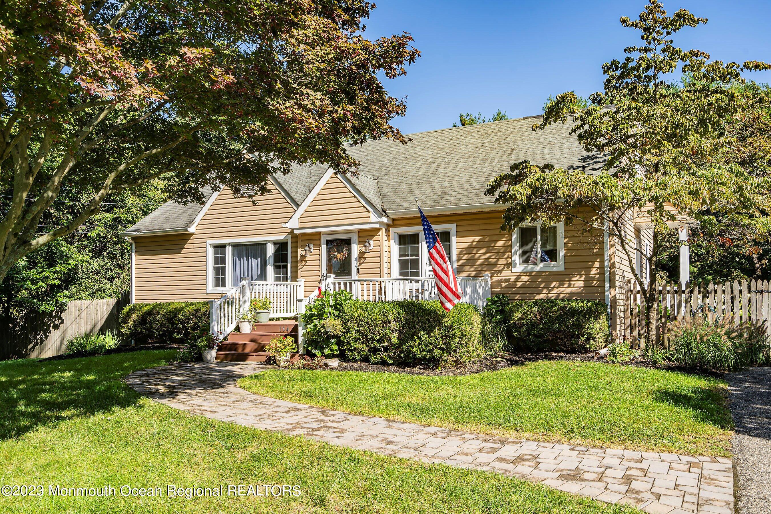 154 Adelphia Road Farmingdale, NJ 07727 - Photo 4 of 34 a front view of house with yard and green space