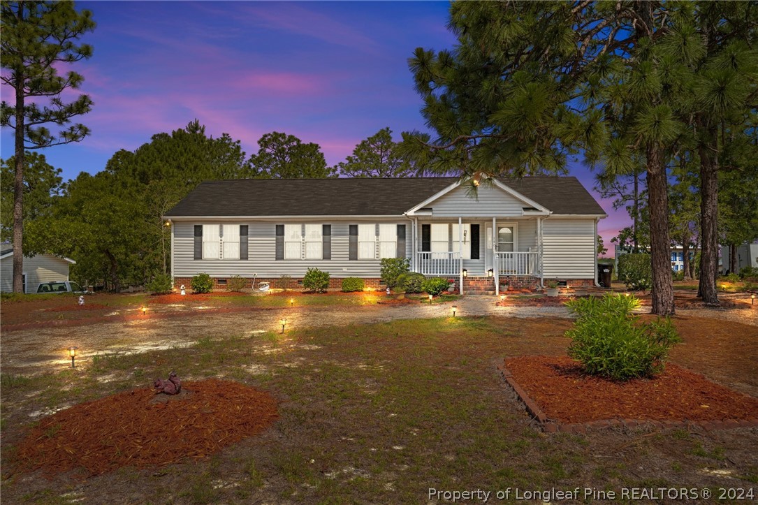 140 Ridge View Drive Cameron, NC 28326 - Photo 1 of 42 a front view of a house with a garden