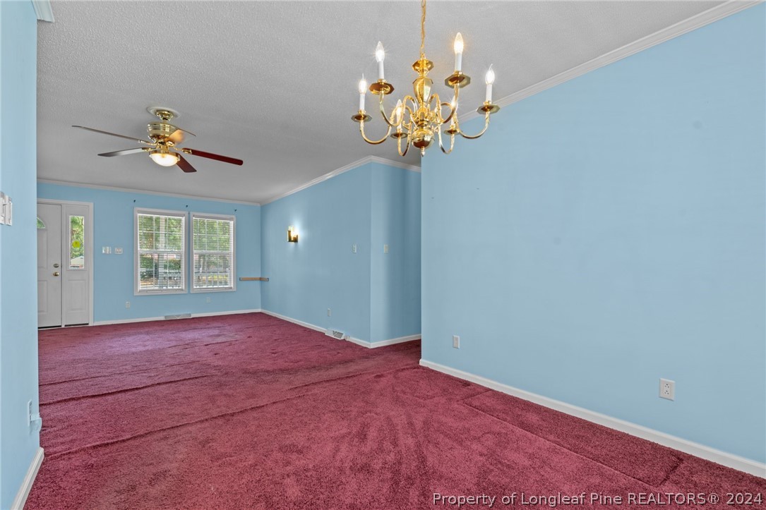 140 Ridge View Drive Cameron, NC 28326 - Photo 18 of 42 a view of a room with a chandelier fan and windows