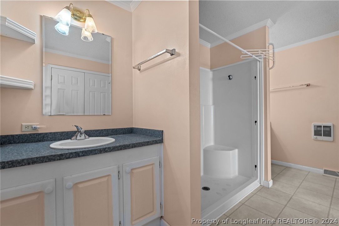 140 Ridge View Drive Cameron, NC 28326 - Photo 25 of 42 a bathroom with a granite countertop sink and a mirror