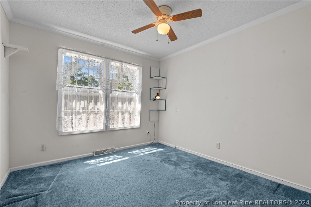 140 Ridge View Drive Cameron, NC 28326 - Photo 27 of 42 a view of empty room with window and ceiling fan