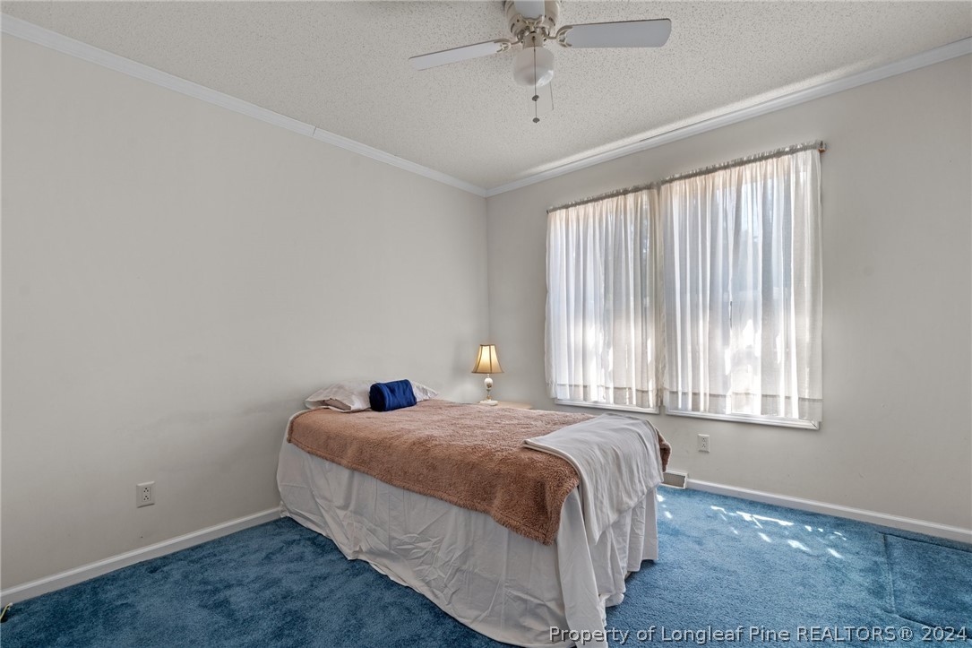 140 Ridge View Drive Cameron, NC 28326 - Photo 29 of 42 a bedroom with a bed and a window