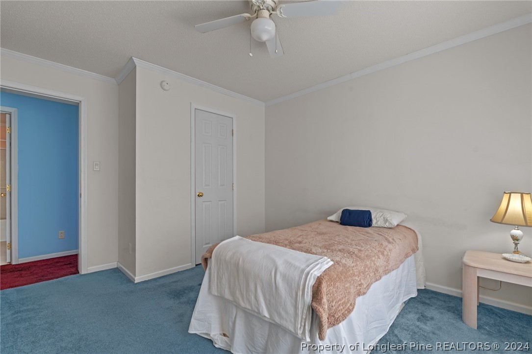 140 Ridge View Drive Cameron, NC 28326 - Photo 30 of 42 a bedroom with a bed and a table