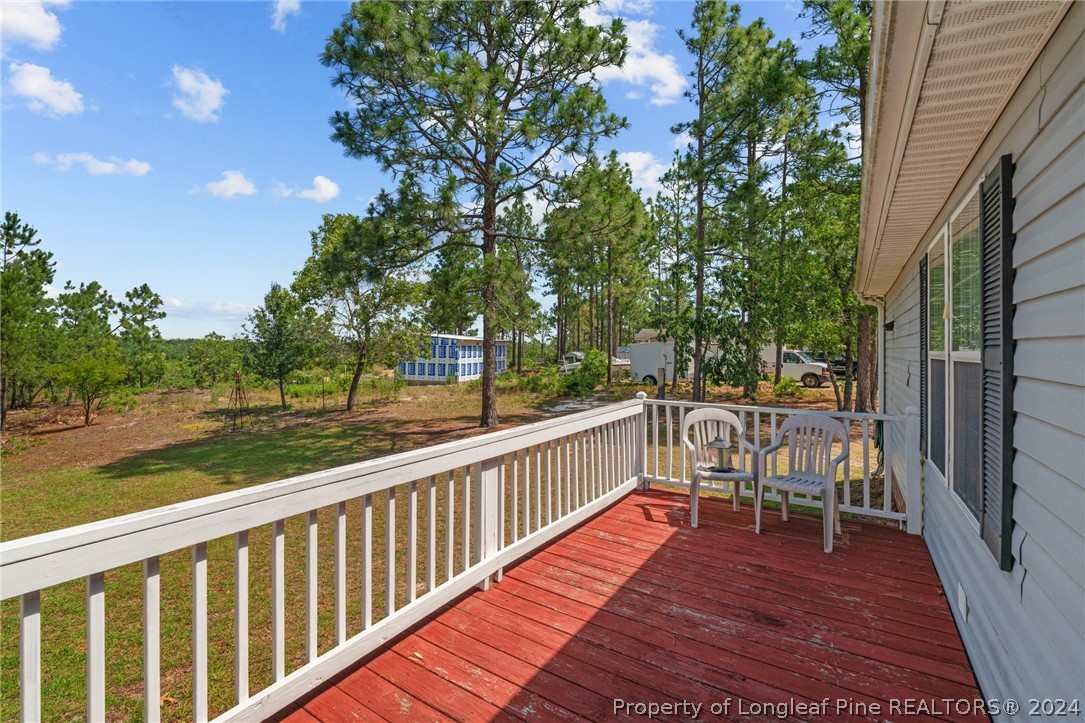 140 Ridge View Drive Cameron, NC 28326 - Photo 32 of 42 a view of balcony with wooden floor and fence