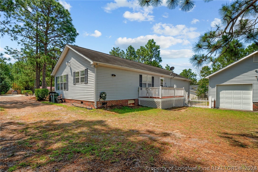 140 Ridge View Drive Cameron, NC 28326 - Photo 33 of 42 a view of a house with a yard and garage