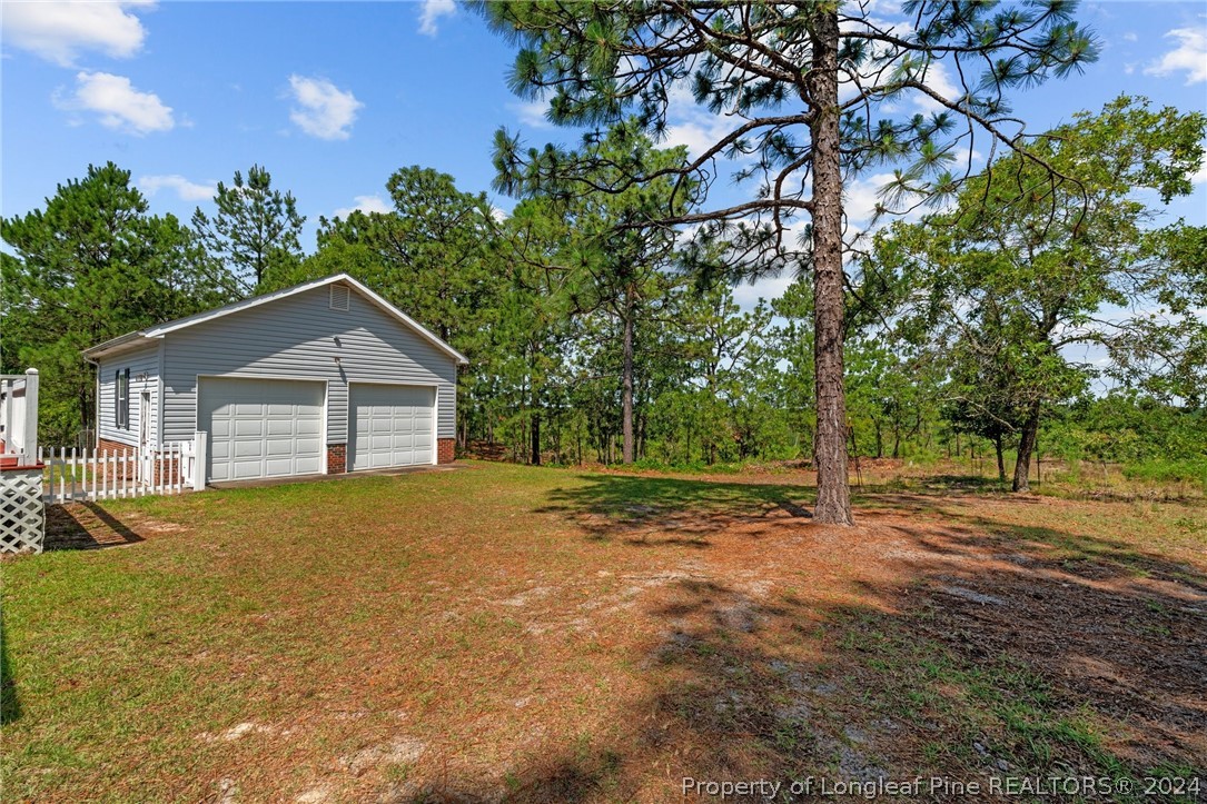 140 Ridge View Drive Cameron, NC 28326 - Photo 37 of 42 a view of a house with backyard and trees