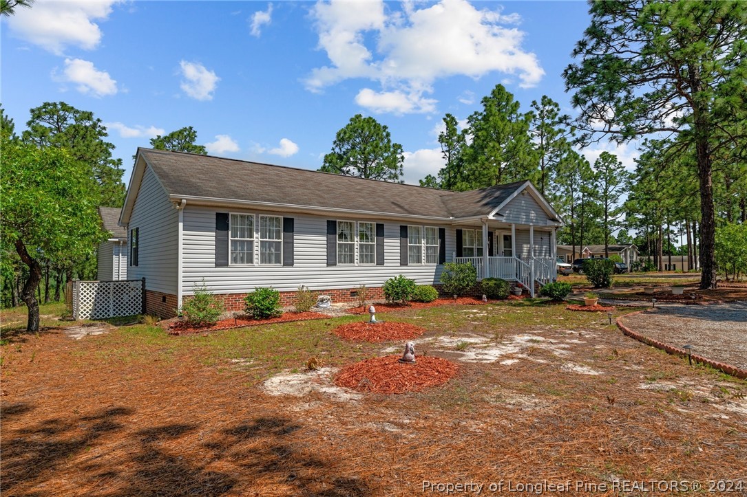 140 Ridge View Drive Cameron, NC 28326 - Photo 40 of 42 a front view of a house with a yard