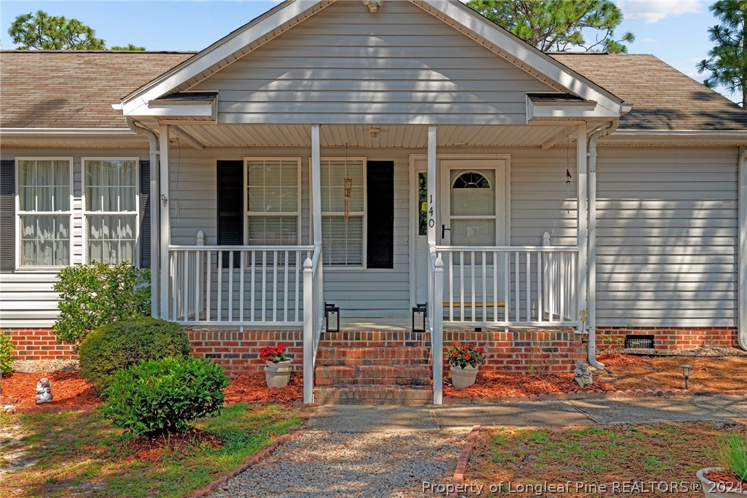 140 Ridge View Drive Cameron, NC 28326 - Photo 6 of 42 a front view of a house with a porch