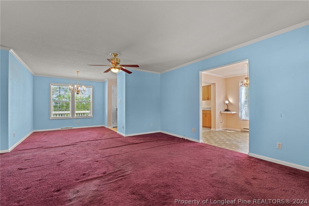 140 Ridge View Drive Cameron, NC 28326 - Photo 9 of 42 a view of a room with a ceiling fan and window
