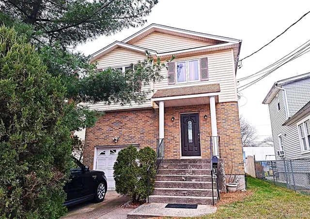 front view of a house with a small yard