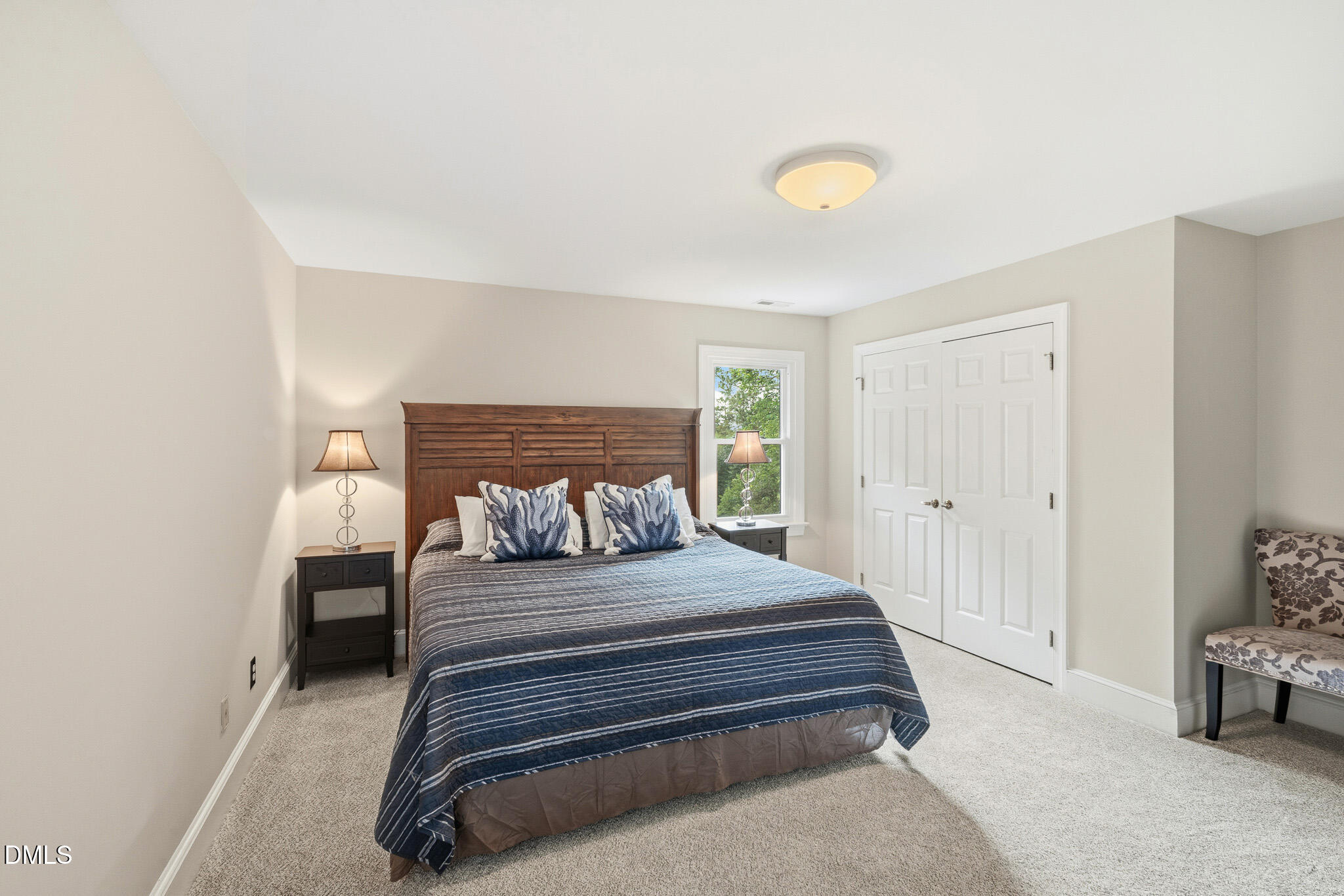 3735 Stoneybrook Drive Durham, NC 27705 - Photo 28 of 44 a bedroom with a bed and a chair
