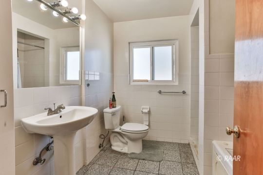 120 South Silver Ridge Street Ridgecrest, CA 93555 - Photo 17 of 35 a bathroom with a sink a toilet and mirror