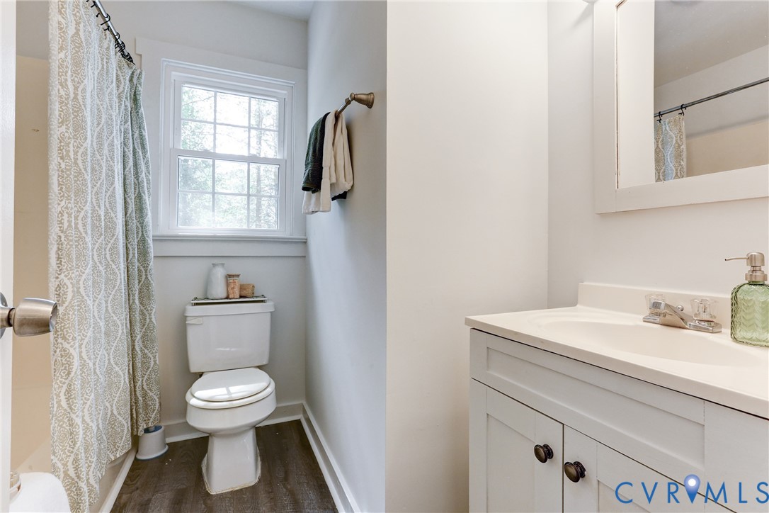 661 Greencastle Road Chesterfield, VA 23236 - Photo 17 of 28 a bathroom with a toilet sink and mirror