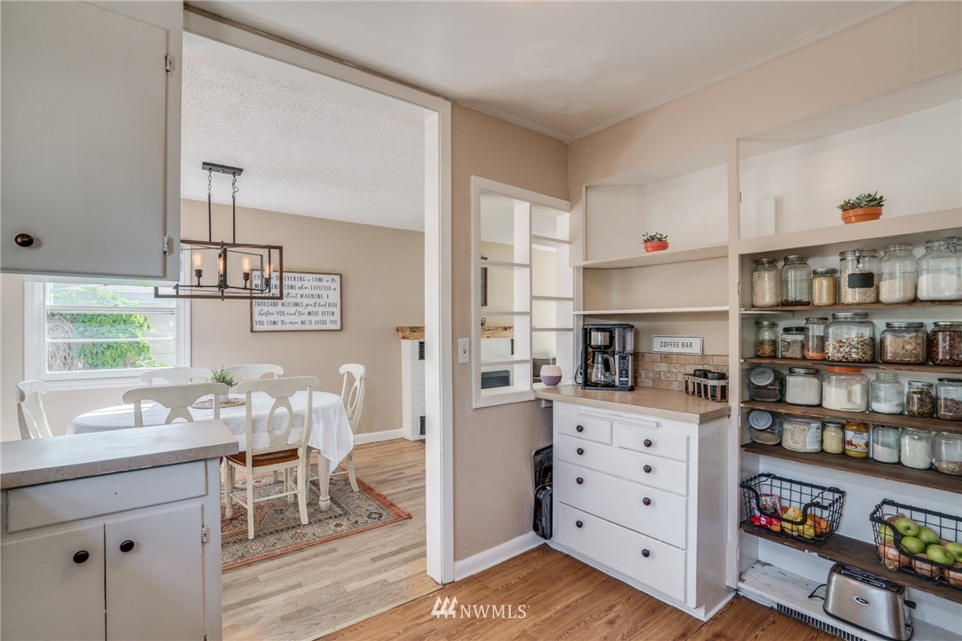 1036 Tyler Street Wenatchee, WA 98801 - Photo 12 of 29 a kitchen with stainless steel appliances a cabinets and wooden floor