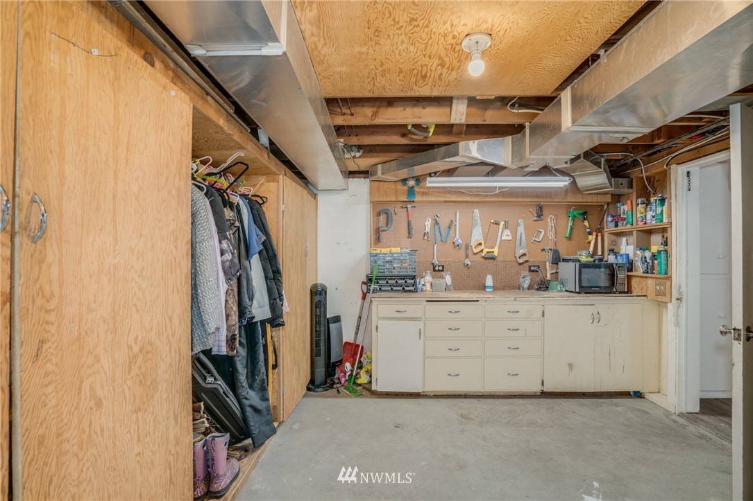 1036 Tyler Street Wenatchee, WA 98801 - Photo 21 of 29 a view of walk in closet with clothes and shoes