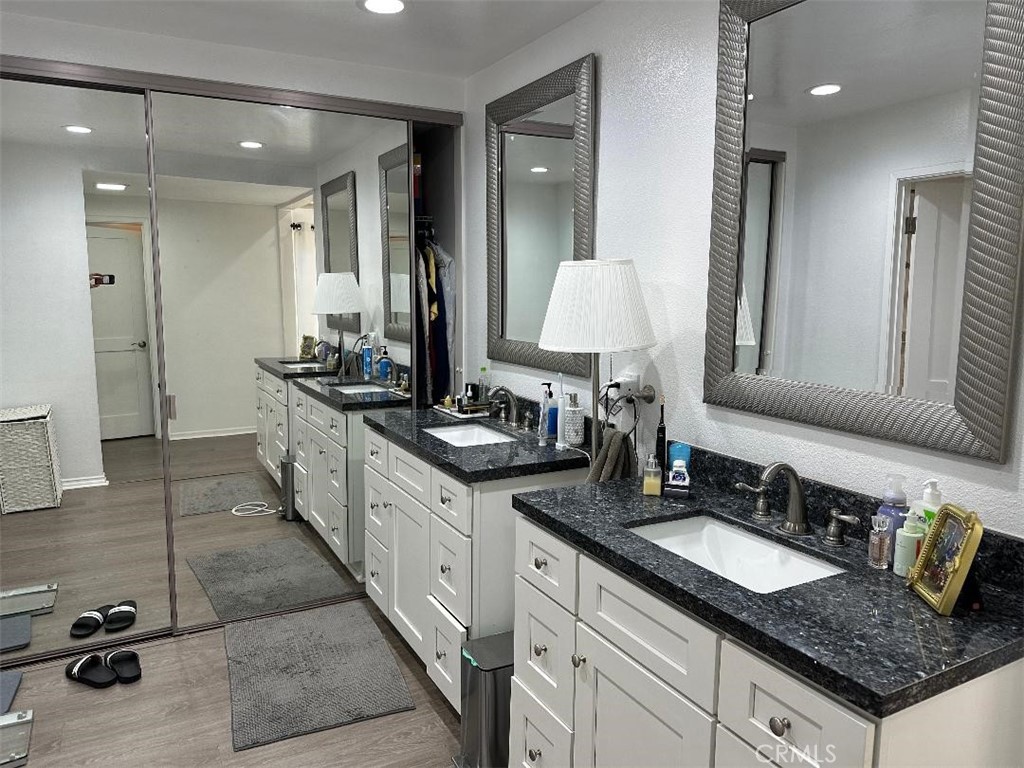 2 Shasta Irvine, CA 92612 - Photo 14 of 17 a spacious bathroom with a granite countertop sink a mirror and a shower