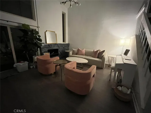 a living room with furniture and a lamp
