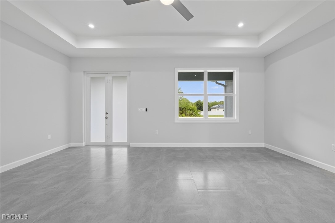 2864 68th Avenue Northeast Naples, FL 34120 - Photo 15 of 47 wooden floor in an empty room with a window