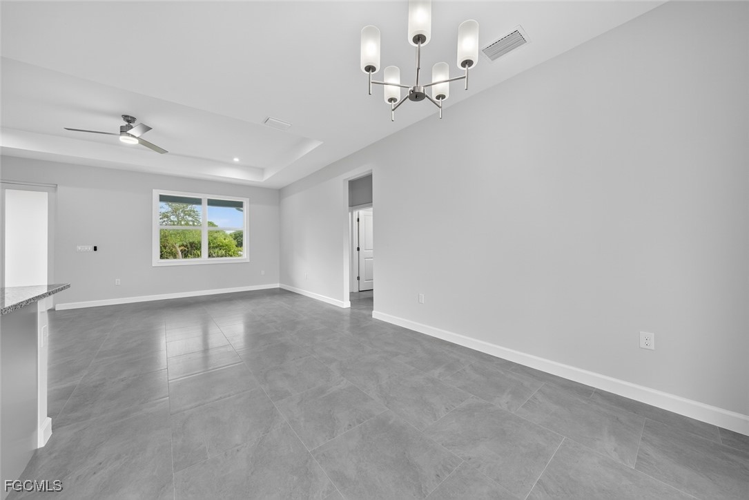 2864 68th Avenue Northeast Naples, FL 34120 - Photo 27 of 47 wooden floor in an empty room with a window