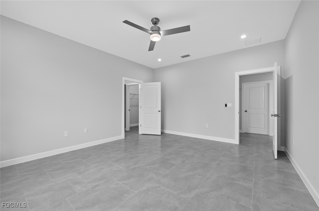 2864 68th Avenue Northeast Naples, FL 34120 - Photo 32 of 47 an empty room with closet and ceiling fan