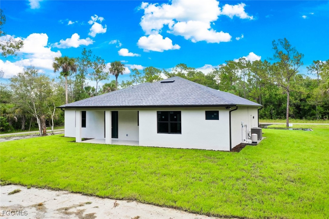 2864 68th Avenue Northeast Naples, FL 34120 - Photo 43 of 47 a view of a house with a yard