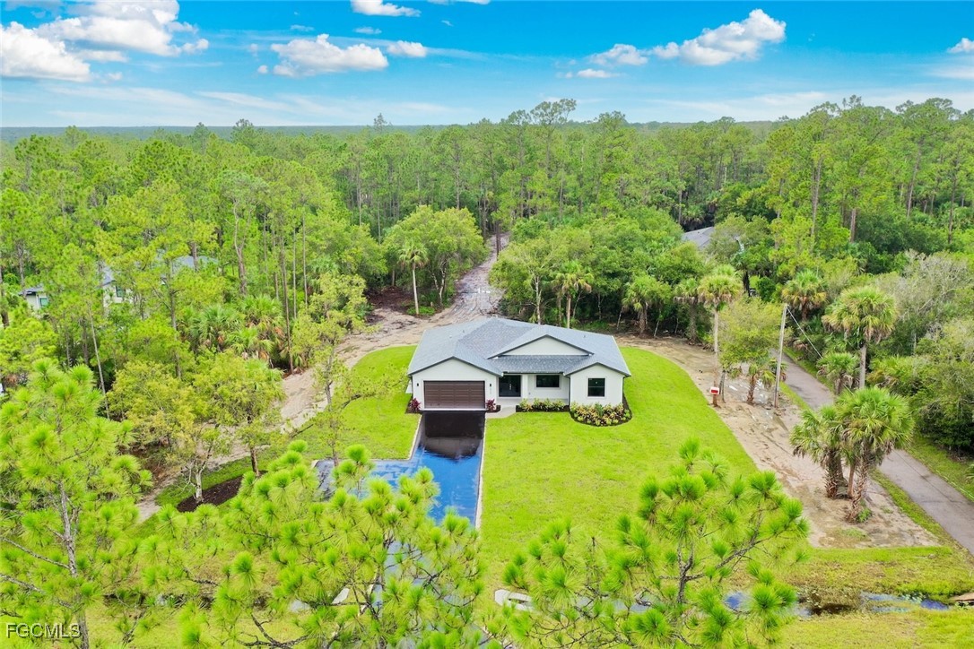 2864 68th Avenue Northeast Naples, FL 34120 - Photo 45 of 47 a view of a lake with huge green field