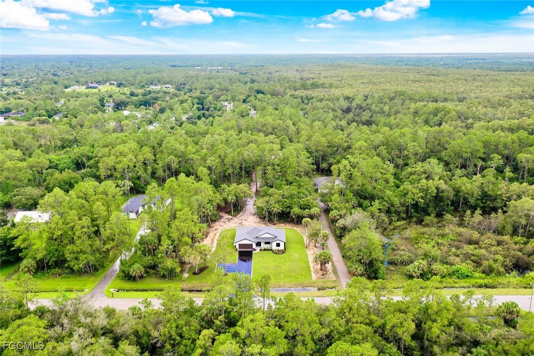 2864 68th Avenue Northeast Naples, FL 34120 - Photo 46 of 47 an aerial view of residential houses with outdoor space and trees