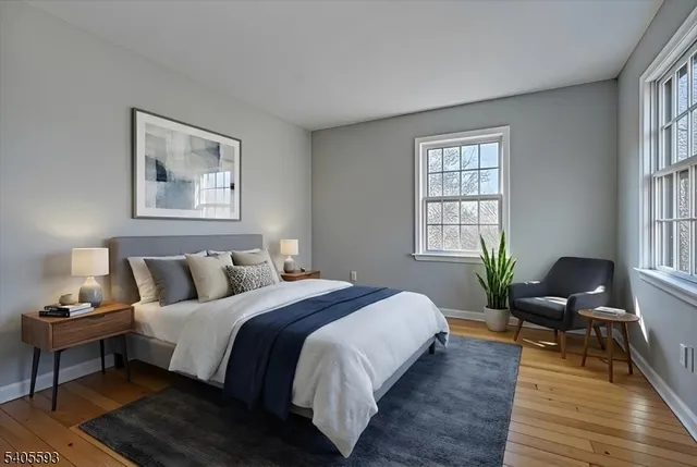 a bedroom with bed and a window