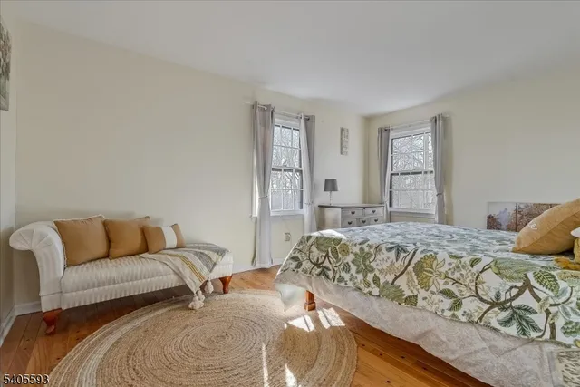 a bedroom with a bed and couch