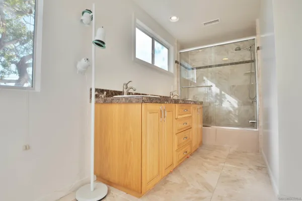 a view of an empty room with glass door