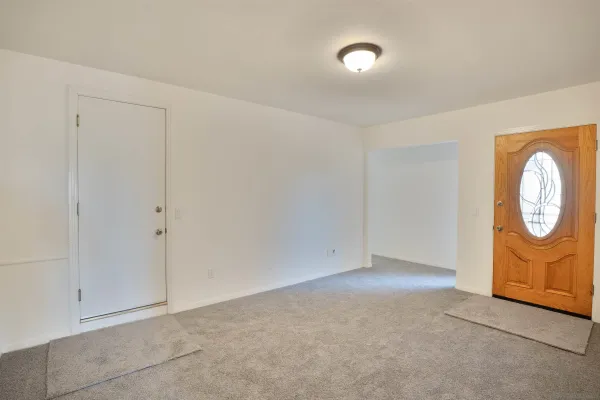 a view of an empty room and window