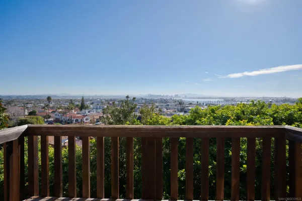 a view of city and a fence