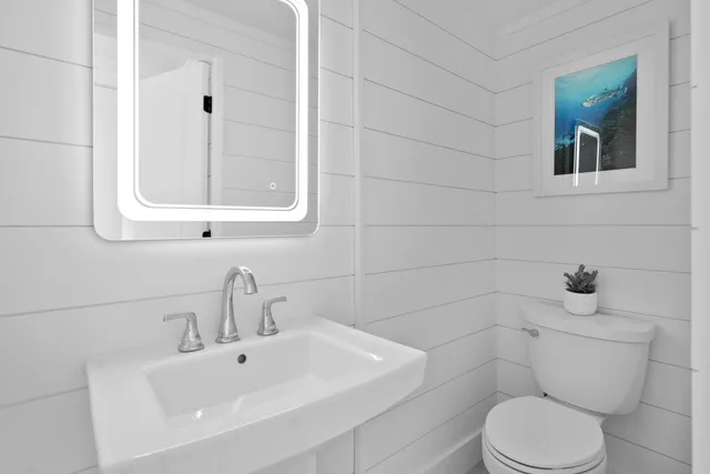 a view of an entryway with wooden floor and windows