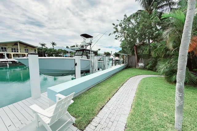 a front view of a house with a yard and a garage
