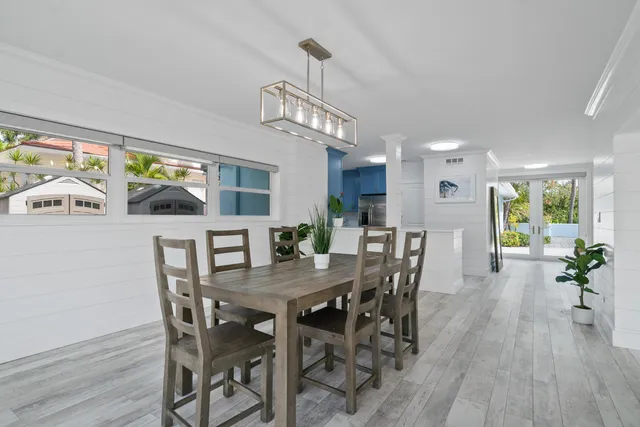 a view of a livingroom with furniture window and wooden floor
