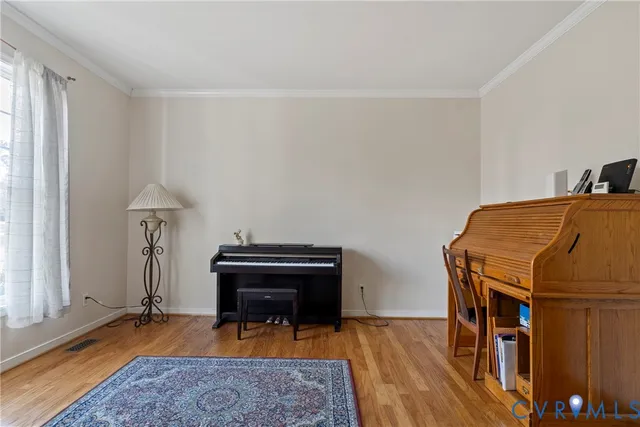a bedroom with furniture and a rug