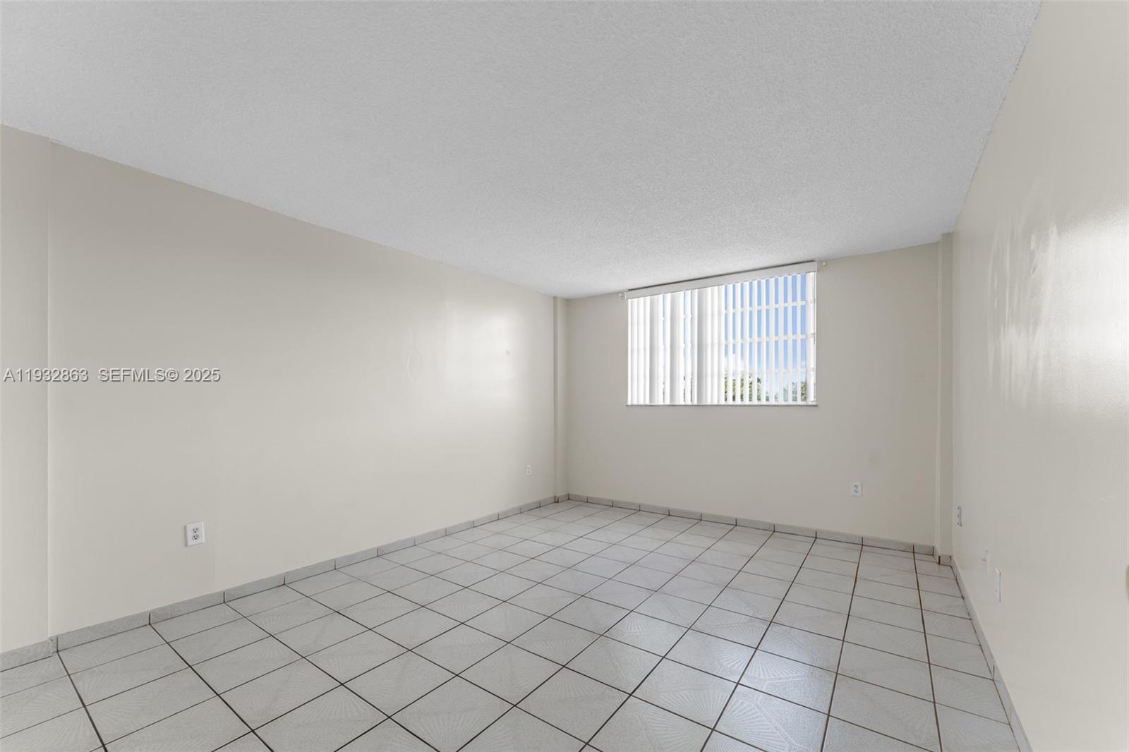 14180 Southwest 84th Street, Unit 508G Miami, FL 33183 - Photo 16 of 32 a view of an empty room and window