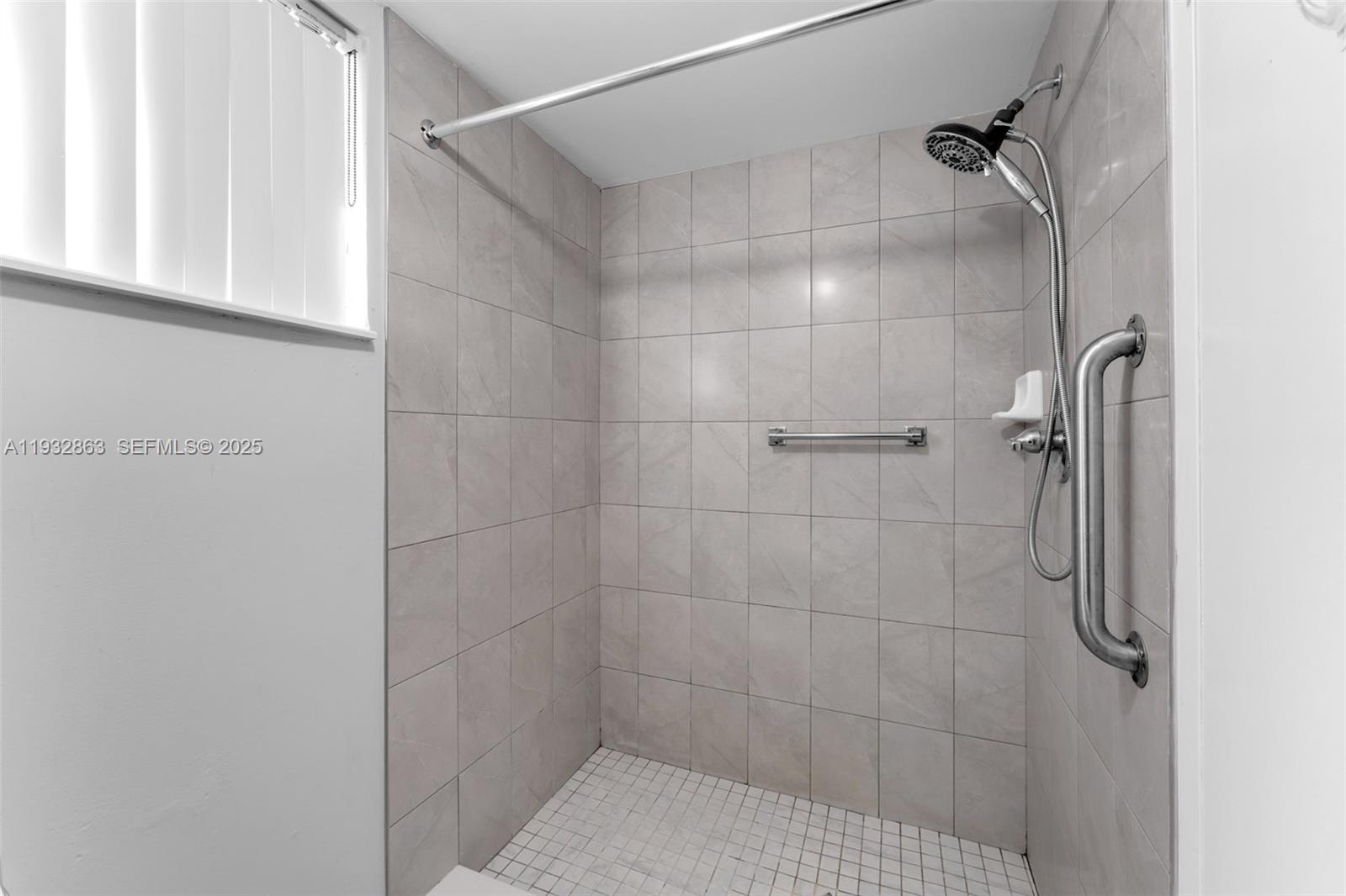 14180 Southwest 84th Street, Unit 508G Miami, FL 33183 - Photo 20 of 32 a bathroom with a shower