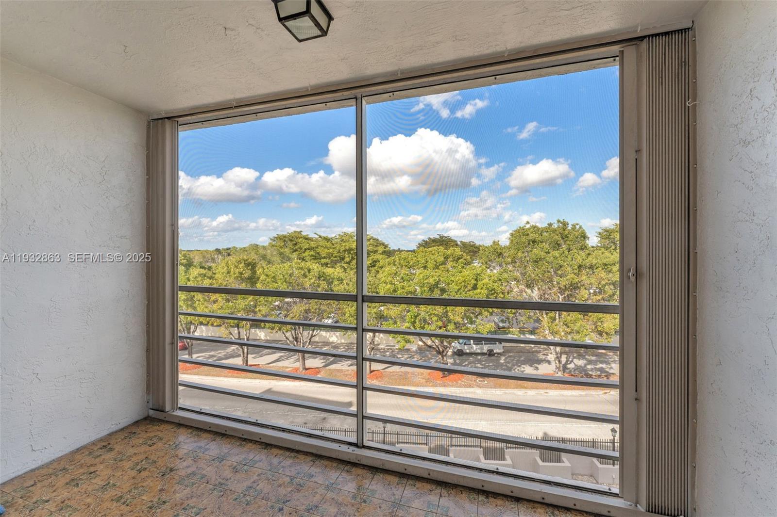 14180 Southwest 84th Street, Unit 508G Miami, FL 33183 - Photo 23 of 32 a view of a glass door