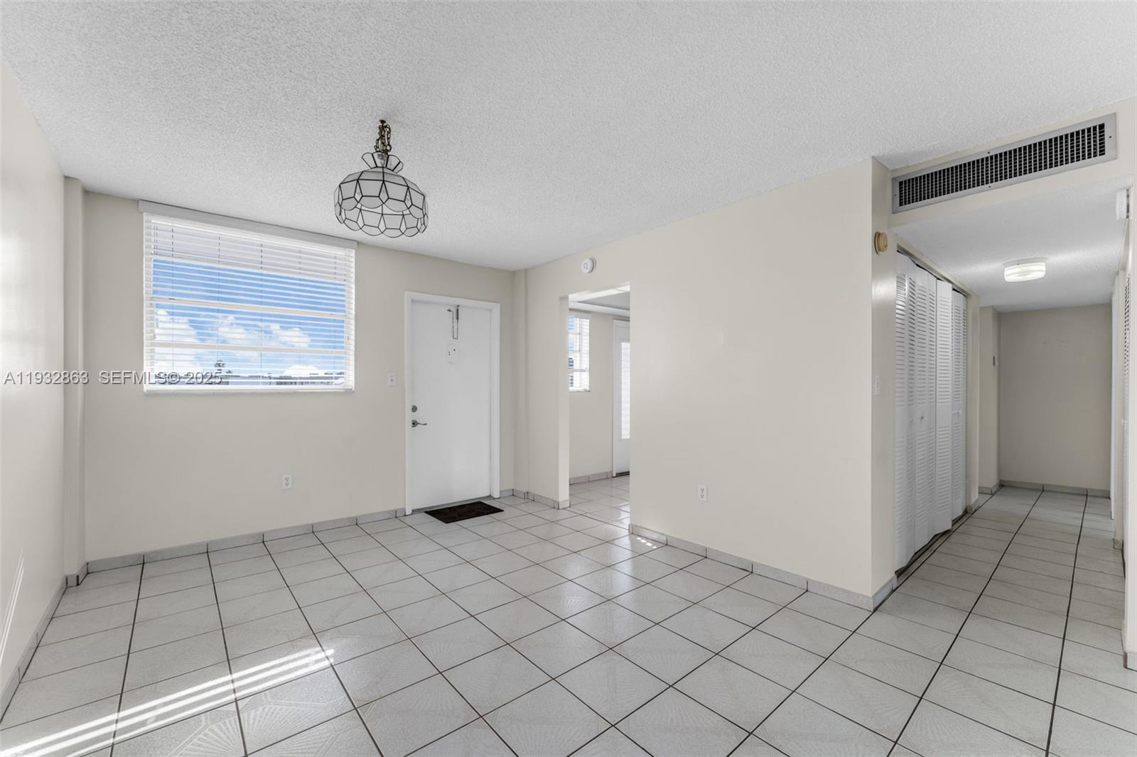 14180 Southwest 84th Street, Unit 508G Miami, FL 33183 - Photo 6 of 32 a view of an empty room and window