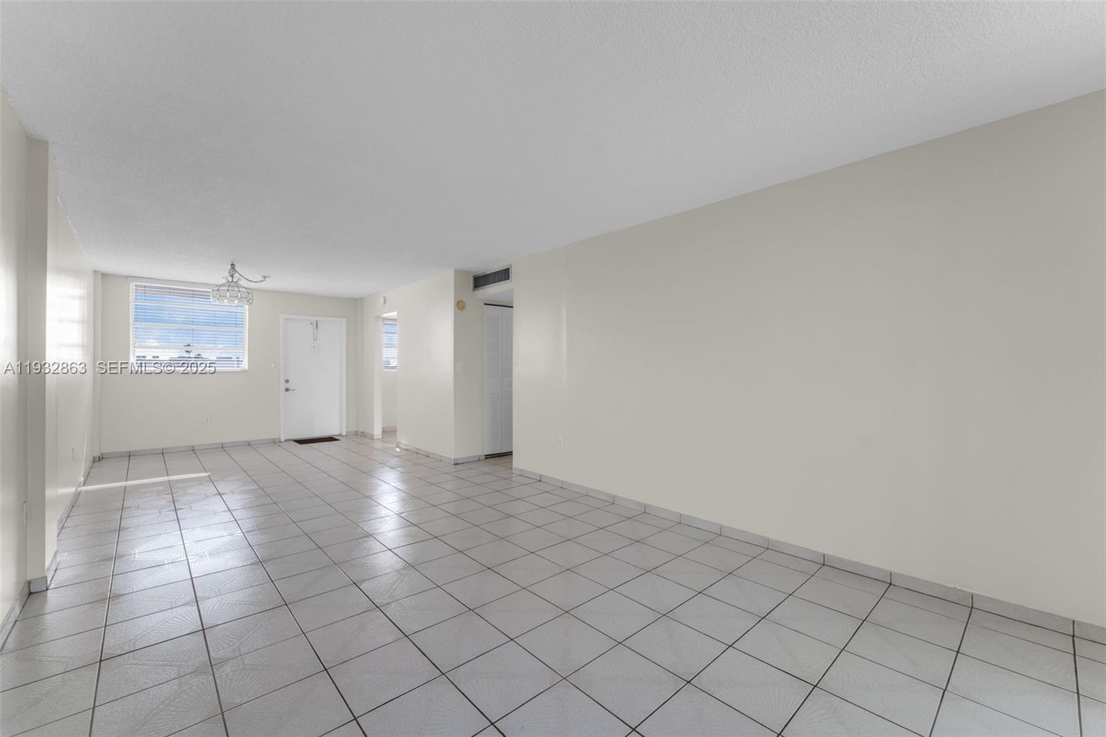 14180 Southwest 84th Street, Unit 508G Miami, FL 33183 - Photo 7 of 32 an empty room with windows