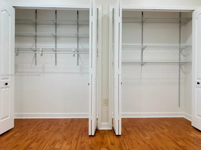 an empty room with wooden floor