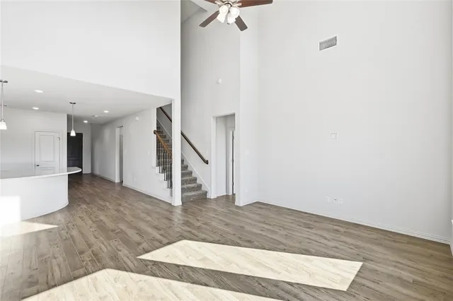 a view of an entryway with wooden floor and door