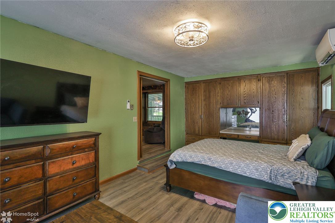 60 Sassafras Road Lehighton, PA 18235 - Photo 28 of 36 Functional bedroom featuring rich wood built-in storage and durable flooring for comfortable living.