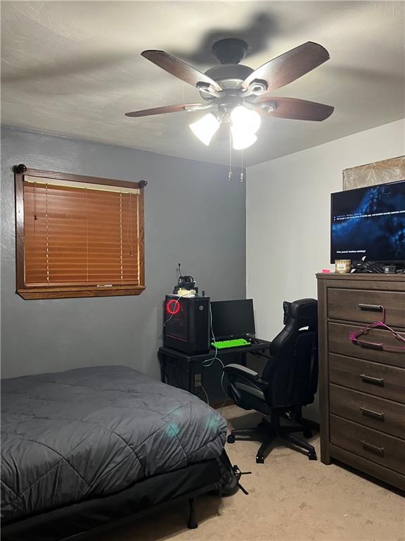145 Coffman Road Acme, PA 15610 - Photo 15 of 37 a bedroom with a bed and wooden floor
