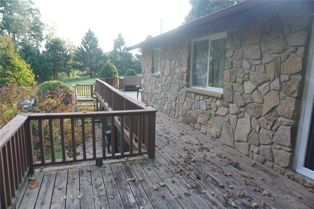 145 Coffman Road Acme, PA 15610 - Photo 27 of 37 a view of balcony with wooden floor and fence