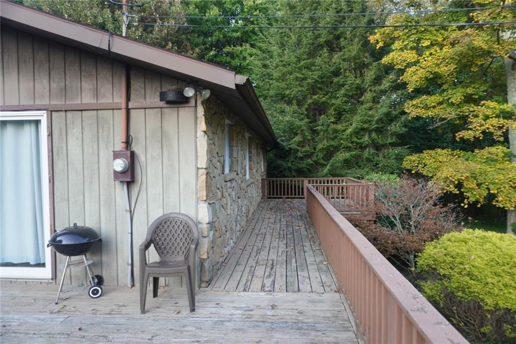145 Coffman Road Acme, PA 15610 - Photo 28 of 37 a view of deck in the backyard with seating space