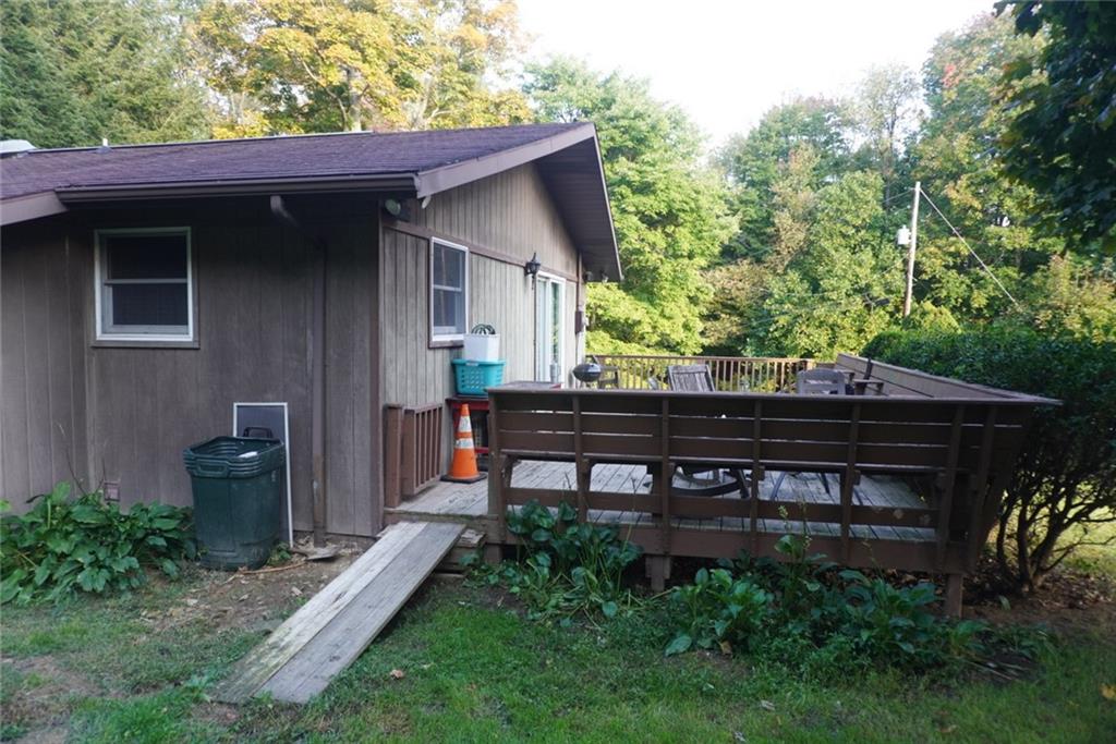 145 Coffman Road Acme, PA 15610 - Photo 30 of 37 a backyard of a house with table and chairs